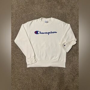White champion sweater with blue embroidered logo